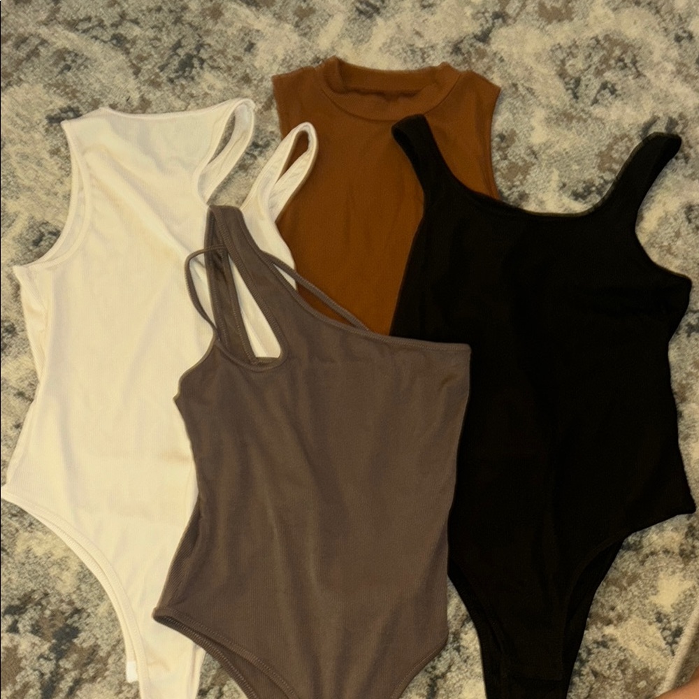 Set of Four Sleeveless Bodysuits in Neutral Tones